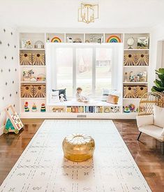 a living room filled with furniture and lots of shelves full of books on top of them