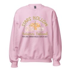 Calling all Gilmore Girls fans! This Stars Hollow pink crewneck is the perfect sweatshirt to keep you warm during comfy cozy season!It's pre-shrunk with a classic fit that's made with air-jet spun yarn for a soft feel.• 50% cotton, 50% polyester• Pre-shrunkWe recommend washing your garment using the gentle cycle and hanging up to dry.Please note:Apparel is made to order, therefore we are unable to accept returns unless you received a damaged item. Please refer to the size chart to help avoid ord Pink Sweater For Fall Streetwear, Pink Sweater For Streetwear In Fall, Fall Pink Hoodie With Graphic Print, Pink Fleece Sweatshirt With Letter Print, Pink Hoodie With Graphic Print For Fall, Pink Crew Top For Fall, Pink Graphic Print Hoodie For Fall, Pink Graphic Print Fall Sweater, Winter Crew Neck Pink Top