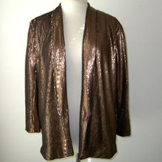 New With Tags. The Blazer Is Done In A Bronze/Silver Sequin. This Has An Open Front, Lapel/Collar Neckline And Is Fulled Lined. Tagged A Zara Women 8. Elegant Metallic Long Sleeve Blazer, Glamorous Metallic Formal Outerwear, Gold Cardigan For Winter Party, Metallic Outerwear For Fall Party, Festive Long Sleeve Blazer For Fall, Metallic Blazer For Evening In Fall, Metallic Long Sleeve Formal Outerwear, Gold Long Sleeve Outerwear For Night Out, Formal Metallic Long Sleeve Outerwear