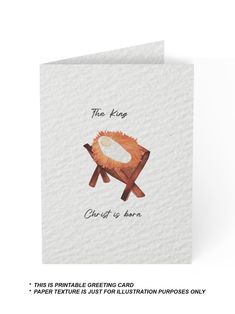 a greeting card with an illustration of a chair and the words, the king christ is born