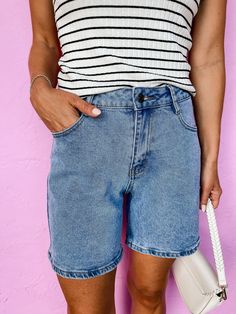 Get your mom shorts game on point with the Berkeley Bermuda Denim Mom Shorts! With a stretchy high waist for ultimate comfort, these shorts feature unique pocket details and a relaxed fit for a laid-back style. Perfect for summer, these bermuda shorts are a must-have in your wardrobe. High waisted No distressing Button and zipper front closure Fit: Relaxed; No stretch except in waist Waist: Small-28in Medium-30in Large-32in XLarge-34in Length: Small-16in Medium-17in Large-18in XLarge-19in Rise: Wedding Guest Accessories, Denim Mom Shorts, Athleisure Summer, Unique Pockets, Mom Shorts, Laid Back Style, Your Mom, Bermuda Shorts, Denim Shorts