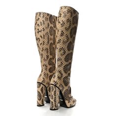 This is an authentic GUCCI Snakeskin Lilian Horsebit Knee High Boots size 36 in Taffy. These tall boots are crafted of snakeskin in brown and beige. These boots feature a covered heel, Gucci silver horsebit on the front, and a squared toe. Brown And Beige, Taffy, Tall Boots, Knee High Boots, Snake Skin, High Boots, Knee High, Gucci, Boots