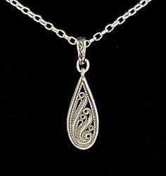 "- Gorgeous Antiqued 925 Sterling Silver Paisley Floral Etched Design Pendant, or Necklace, with Antique Silver Plated Brass Self-Closing Bail in Vine motif. See Photos #1-4. - Beautiful Etched Detailing in popular Paisley Floral Design. - 925 Sterling Silver Filled Oval Rolo Chain included. - 20\" Length. - Closure with Antique 925 Sterling Silver Plated Pewter Hook & Eye Clasp in Vine motif. See Photo #5. - Upon request, we can customize, at no cost, the Clasp type. Other Clasps available Classic Teardrop Jewelry With Intricate Design, Elegant Teardrop Necklace With Oxidized Finish, Classic Silver Teardrop Drop Necklace, Classic Silver Teardrop Pendant Necklace, Silver Engraved Teardrop Jewelry, Classic Sterling Silver Teardrop Drop Necklace, Classic Teardrop Engraved Jewelry, Sterling Silver Teardrop Necklaces Engraved, Sterling Silver Teardrop Engraved Necklace