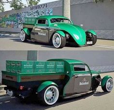 an old green truck parked in front of a building