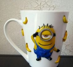 a close up of a coffee cup with a minion on it