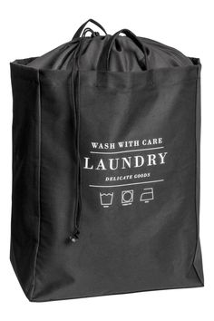 a black laundry bag with the words wash with care on it