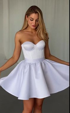 Look breathtakingly beautiful on your special day with this White Wedding Short Corset Dress. This enchanting ensemble features an Overbust Corset Top paired with a stunning Mini Skirt, making it perfect for a Birthday celebration or a fun Bachelorette Party. The Corset Bustier Top enhances your figure, while the flirty skirt adds a touch of elegance. Embrace your femininity and make a statement with this exquisite corset dress that will surely turn heads wherever you go. Make unforgettable memo Fitted A-line Corset Dress For Debutante Ball, Elegant Mini Dress For Debutante Ball And Prom Season, Fitted Mini Dress For Prom Season And Debutante Ball, Fitted Mini Dress For Debutante Ball And Prom Season, Fitted Full Skirt Mini Dress For Party, White A-line Corset Dress For Prom, Elegant White Skirt For Debutante Ball, Fitted Party Skirt With Corset Back, Fitted Full Skirt Bridesmaid Dress