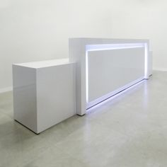 two white pedestals in an empty room