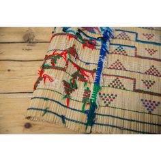 a close up of a piece of cloth on a wooden floor