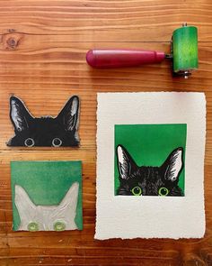 three different pictures on a wooden surface, one with a cat's head and the other with an animal's face