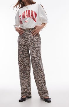 A fierce animal print covers these trouser-inspired jeans designed with relaxed straight legs and a comfortable high waist. 28 1/2" inseam; 17 1/2" leg opening; 13" front rise; 15 1/2" back rise (size 8) Zip fly with button closure Side-seam pockets; back patch pockets 100% cotton Machine wash, line dry Made in Turkey Topshop Jeans, Print Trends, Straight Leg Denim, Maxi Dress Trend, Swimwear Sale, Designer Jeans, Fall Style, Hoodies For Sale, Fall 2024