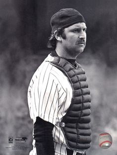 a black and white photo of a baseball player