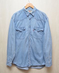 Levis Vintage Denim Western Shirt Size L Rare Very good used condition, there are some minor stains, you can see it in the photo. Size L PLEASE CHECK MEASUREMENTS!! pit2 pit: 24" inches \ 61 cm length on the back: 31'1" inches \ 79 cm from shoulder to the end of sleeve: 24'8" inches \ 63 cm shoulders: 20'8" inches \ 53 cm If u have any questions please contact me before purchase Blue Washed Shirt For Streetwear, Vintage Light Wash Denim Shirt, Vintage Washed Denim Shirt, Vintage Medium Wash Washed Shirt, Vintage Medium Wash Shirt With Pockets, Vintage Medium Wash Denim Shirt, Vintage Washed Blue Denim Shirt, Vintage Light Wash Button-up Shirt, Vintage Denim Blue Button-up Outerwear