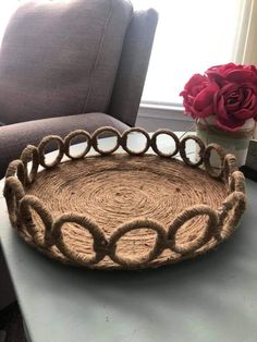 a basket sitting on top of a table next to a window