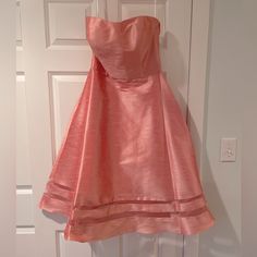 Alfred Sung Strapless Dress, Coral, Size 10. Never Worn, Brand New Condition With Tags Attached. Summer Evening Strapless A-line Dress, Summer Evening A-line Strapless Dress, Strapless Spring Dress For Formal Occasions, Strapless Sundress Midi Dress For Party, Strapless Sundress For Party, Strapless Dress For Spring Formal, Strapless Formal Dress For Spring, Summer Strapless Midi Evening Dress, Strapless Spring Formal Dress