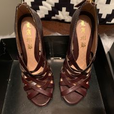 L.A.M.B. Brown Leather Cage Sandals. Back Zip With Gold Accent. Like Brand New. Worn Once. The Tammy Heel Features A Gorgeous Brown Leather Upper With Weaving At The Vamp Revealing An Open Toe, A Golden Zipper At The Heel Counter Embossed With The Lamb Symbol, And Finally A 4 Inch Stacked Stiletto Heel. Fun And Flirty, This Heel Spices Up Any Outfit. Ships With L.A.M.B. Dustbag (As Shown), But Not Box. Brown Wedge Heel Sandals With Padded Heel, Brown Block Heel Wedge Sandals For Party, Brown High Heel Wedge Sandals For Party, Brown Wedge Sandals With Heel Strap For Party, Brown Heel Strap Wedge Sandals For Party, Brown Closed Toe Heels With Heel Strap, Brown Closed Toe Heels With Wrapped Heel, Brown High Heels With Heel Loop, Brown High Heel Wedge Sandals With Heel Strap