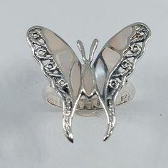 This stunning ring has been carefully crafted from scratch in warm 925 sterling silver. This butterfly ring will make a great special occasion/birthday gift. This delicate ring will not go unnoticed. All of my jewelry is handmade from scratch one item at a time. A tracking shipping number will be provided to you once the ring has been mailed.  Ring Measurements and Materials: Ring is size 5 1/2 but can be resized at no extra cost and will be shipped to you in an elegant gift box. Ring Weight: 4. Silver Sterling Silver Moonstone Ring As Gift, Unique Butterfly Sterling Silver Ring, Handmade Silver Butterfly Open Ring, White Sterling Silver Opal Ring Stamped 925, Engraved Silver Moonstone Ring Gift, Silver Butterfly Rings As Gift, Sterling Silver Hallmarked Butterfly Ring For Wedding, Sterling Silver Hallmarked Butterfly Wedding Ring, Handmade Sterling Silver Butterfly Ring For Anniversary