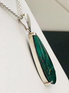 This stunning piece of malachite is such a rich, beautiful green! It is set in a custom made frame crafted in sterling silver. It hangs on a 20 inch sterling silver popcorn chain. This will quickly become your new favorite piece! Elegant Oval Chrysocolla Necklace, Elegant Green Chrysocolla Jewelry, Elegant Chrysocolla Cabochon Necklace, Formal Malachite Jewelry With Polished Finish, Silver Emerald Teardrop Pendant Jewelry, Elegant Silver Malachite Jewelry, Cinderella Slipper, Pear Shaped Pendant, Glendale Az