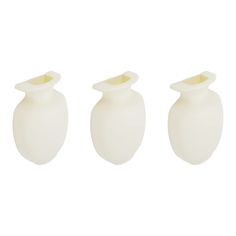 three white vases sitting next to each other