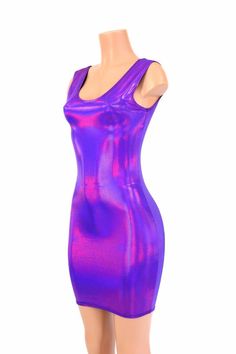 "This item is made to order, please read all the way through the listing before purchasing! This dress is made of a grape purple holographic spandex, with AMAZING shine! The deep purple reflects liquid fuchsia rainbows all over your curves, accentuating every move you make! It features a scoop tank style neckline in front and back.. It is made of four way stretch lycra spandex, and it fits like a glove! Super figure flaunting and fun! LENGTH: 27\" (from the underarm to the hemline) Womens Sizing Purple Stretch Bodycon Party Dress, Purple Bodycon Dress For Club, Iridescent Fitted Mini Dress, Purple Stretch Dress For Club, Purple Fitted Bodycon Dress, Purple Stretch Bodycon Dress For Night Out, Stretch Purple Mini Dress For Club, Purple Stretch Mini Dress For Club, Purple Sleeveless Bodycon Dress For Club