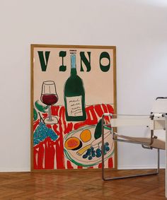 there is a painting on the wall next to a glass of wine and a bottle