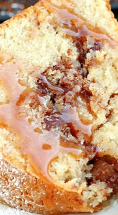 a close up of a piece of bread on a plate with jelly and chocolate toppings