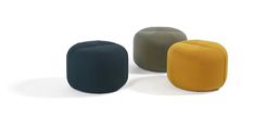 three different colored stools sitting next to each other