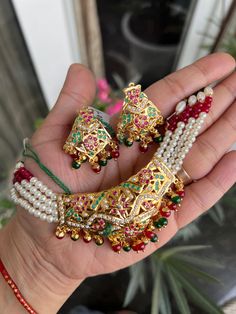 Hey, Welcome to our shop! Jadau Necklace Set With Matching Earring/Red Pearl Navaratan jadau /Indian Women Choker Set/ Fashion Jewellery /Jewelry/24k gold plated Necklace Set / Hyderabadi Jadau Jewellery Wedding Jewelry/Polki Earring/ Best Gift For Anniversary/ Birthday/ Engagement.  < 1 DAY ITEM SHIPMENT | 7-8 Days Delivery TIME> About our Jewellery - Classic, Brilliant & Elegant. We deal in all type of Premium Indian Bollywood Jewellery. * AD Jewelry set * Kundan Necklace * Polki Jewellery * Uncut Jewellery * AD Ring * AD Bangles * AD Pendant Set * Pachi Kundan & many more.. * All our products are made with high-quality stones, the intricate texture and design makes it a must-have for every modern woman. 100% Brand New & 100% High Quality All jewelry Sets & Other Product Material : Brass Jadau Sets Indian Jewelry, Gold Jadau Necklace, Jadau Jewellery Traditional, Jadau Choker Set, Jadau Necklace Set, Jadau Three Piece Necklace, Jadau Necklace, Jadau Jewellery, Polki Earrings