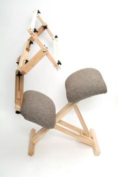 a chair that is made out of wood and has two chairs attached to the back