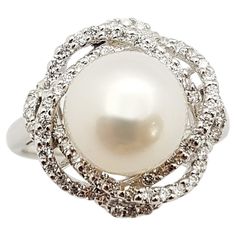 Pearl with Diamond 0.33 carat Ring set in 18 Karat White Gold Settings Width: 1.5 cm Length: 1.5 cm Ring Size: 53 Total Weight: 5.33 grams "We first opened doors in 1980 when it was then situated in the vicinity of the Victory Monument; a small and modest storefront with a couple of counters. From its humble beginnings to where it stands today, our company has proven its abilities as a jeweler. Since the beginning, we have been supplying fine quality pieces to dealers, wholesalers and customers Luxury Fine Jewelry Pearl Ring With Single Diamond, Luxury Pearl Rings With Brilliant Cut, Luxury Diamond Ring With Pearl Drop, Fine Pearl Jewelry, Diamond Ring Set, Pearl And Diamond Ring, White Gold Set, Diamond Ring Settings, Pearl Diamond