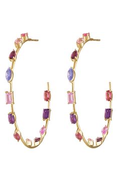 Multicolor crystals in a variety of faceted cuts bring vibrant sparkle to slim hoop earrings rendered from polished 14-karat gold. 2" hoop diameter; 1/8" width 14k gold/pink sapphire Made in the USA Pink Sapphire Hoop Earrings, Crystal Goddess, Crystal Hoop Earrings, Curator Style, Pink Sapphire, Eden, Made In The Usa, Sapphire, Jewelry Earrings