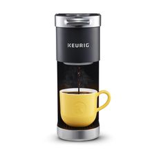 a keurig coffee maker with yellow cup