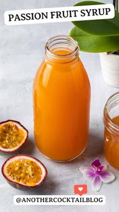 passion fruit syrup in a glass jar next to two pieces of fruit and a flower