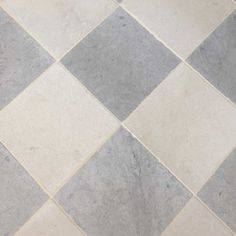 a white and grey checkered floor with an umbrella