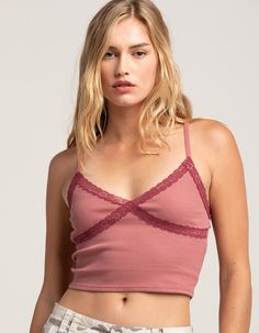 Rsq Lace Trim Cami. V-Neck. Rib Knit Construction. Lace Trim On Neckline And Underbust. Adjustable Spaghetti Straps. Cropped Fit. 48% Cotton, 47% Polyester, 5% Spandex. Machine Wash. Imported. Model Is Wearing A Size Small. Model Measurements:height: 5'8" Bust: 32"waist: 24"hips: 34" Summer V-neck Crop Top For Layering, Trendy V-neck Bra Friendly Tops, Casual V-neck Crop Top With Lace Trim, Feminine Seamless V-neck Camisole, Trendy V-neck Crop Top, Casual Seamless V-neck Camisole, Trendy V-neck Crop Top For Layering, Trendy V-neck Top Bra Friendly, Trendy V-neck Top, Bra Friendly