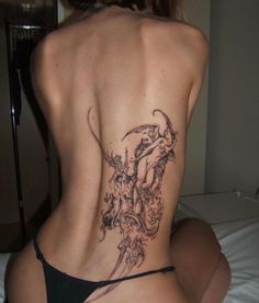 a woman with a tattoo on her back