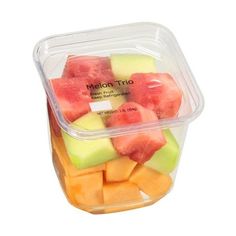 a plastic container filled with slices of watermelon and melon cubes on top of each other