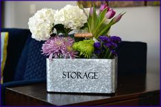 a flower arrangement in a storage container on a table with the word storage written across it