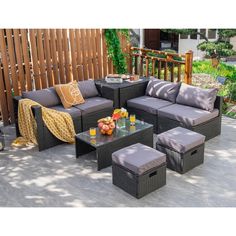 an outdoor patio furniture set with grey cushions