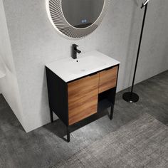 a bathroom with a sink and mirror on the wall next to a black floor lamp