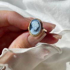 Introducing the GAYLA JO ring! Featuring a beautiful, elegant blue agate cameo ring framed by a textured golden silver sterling. Ring is easily adjustable to fit any adult size. The silver band is completely irritation and allergy free, silver sterling 925.  Perfect gift for mothers day, anniversary, bridal jewelry, wedding jewelry. *part of a matching set! checkout the necklace section in our shop  Agate is a variety of banded Chalcedony, which is a variety of the mineral Quartz, known for help Cameo Ring Gem, Classic Cameo Rings As A Gift, Classic Cameo Rings As Gift, Classic Cameo Rings Gift, Yellow Gold Cameo Rings For Gifts, Gift For Mothers Day, Cameo Ring, Allergy Free, Blue Agate