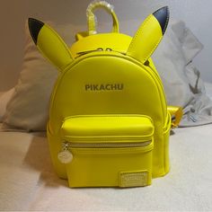 Brand New With Tag Loungefly Pokemon Pikachu Minimalist Figural Mini Backpack Cute Yellow Backpack For Students, Cute Yellow School Backpack, Cute Yellow Backpack For Back To School, Playful Yellow Bags For Back To School, Kawaii Yellow School Bag, Yellow Kawaii Bag For Back To School, Yellow Kawaii School Bag, Cute Yellow Student Bags, Cute Yellow Travel Backpack