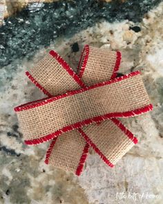 three burlap bows tied together on a granite counter top with text overlay that says how to make burlap bow ties