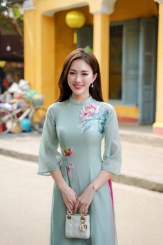 PRODUCT SET INCLUDES:  - Material: tằm thêu - Style: fit form, zipper on the back - Size: S-M-L-XL-XXL - Package: dress & pants - The product is suitable for many skin tones. - Size specifications:              SIZE S: Burst [76 - 79]; Waist [65 - 68]; Hips [80 - 83] Height: 40 - 47KG SIZE M: Burst [80 - 83]; Waist [69 - 72]; Hips [84 - 87] Height: 48 - 53KG SIZE L: Burst [84 - 87]; Waist [73 - 76]; Hips [88 - 91] Height: 54 - 58KG SIZE XL: Burst [88 - 91]; Waist [77 - 80]; Hips [90 - 94] Height Luxury Formal Ao Dai For Spring, Luxury Floral Embroidered Ao Dai For Spring, Vietnam Dress, Skirt Pants, Dress Clothes For Women, Lotus, Vietnam, Long Dress, Mac