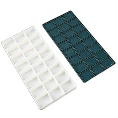 two ice trays sitting next to each other