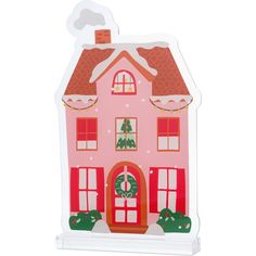 a pink house shaped card with a christmas decoration on the front and side of it