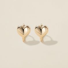 Heart goes padam padam in these hoops. Boo’s chubby heart motif, set on a 6mm huggie, are the sweetest addition to your ear stack. Minimal, sophisticated and chic, these shapely hoops will have hearts skipping beats. Created for you in the finest 14 karat gold, you'll want to wear these earrings always and never take them off, even when working out or in the shower. Padam Padam, Huggie Earrings Gold, Heart Motif, Ear Stack, Huggie Earrings, Recycled Gold, Polish Jewelry, Jewelry Online, Huggies Earrings