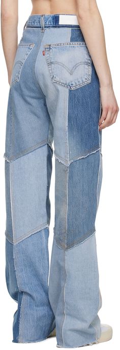 Wide-leg non-stretch denim jeans. Raw edges, exposed seams, and fading throughout. · Patchwork construction · Belt loops · Two-pocket styling · Button-fly · Leather logo patch at back waistband · Contrast stitching in tan Part of the Re/Done x Levi's collaboration. Supplier color: Indigo patched Reworked Rigid Denim Jeans In Denim Blue, Reworked Rigid Denim Blue Jeans, Straight Leg Deconstructed Denim Jeans, Blue Straight Leg Deconstructed Jeans, Deconstructed Straight Leg Denim Jeans, Patchwork Rigid Denim Straight Leg Jeans, Deconstructed Blue Recycled Denim Jeans, Blue Deconstructed Recycled Denim Jeans, Blue Rigid Denim Deconstructed Jeans