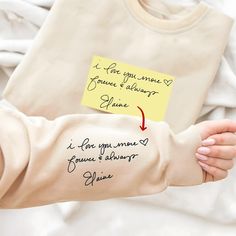 ❤️ WELCOME TO OUR STORE! This customized sweatshirt features actual handwriting embroidery, allowing for a personalized touch that makes it the perfect gift for couples or loved ones. Made with high-quality materials, this hoodie is perfect for matching or as a unique Christmas gift for her. 🎉 CUSTOMIZED CONTENT - After placing the order, please send us the photo of your pet, your family, your loved ones or just your favorite photos directly in the Etsy Message or to our email: support@personalizy.com. I'll do everything to make it look perfect on the shirt 🥰 - These photos can be cherished memories, joyful moments, or special scenes, making them unique embroidered patterns on the shirt. 🎉 PROCESSING AND SHIPPING TIME - Package arrives in 5-10 business days  🎉 PRODUCT AND BRAND DETAILS Personalized Long Sleeve Hoodie For Gift, Long Sleeve Hoodie With Letter Print For Gift, Gift Sweatshirt With Embroidered Text And Long Sleeves, Custom Text Long Sleeve Sweatshirt As A Gift, Customizable Winter Gift Sweatshirt, Personalized Casual Long Sleeve Sweatshirt, Long Sleeve Letter Print Sweatshirt Gift, Long Sleeve Letter Print Sweatshirt For Gift, Letter Print Long Sleeve Sweatshirt For Gift