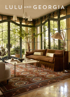 A brown sofa atop a traditional, vintage-inspired rug in a beautifully lit room surrounded by greenery outside Burled Wood Furniture, Luxe Furniture, Lulu And Georgia, Outdoor Furniture Collections, Outdoor Dining Furniture, Dining Room Bench, Long Hours, Coffee Table Square, Furniture Dining Table